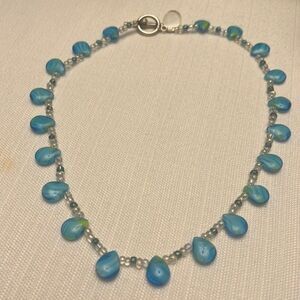 Handcrafted blue and clear glass stone necklace.
